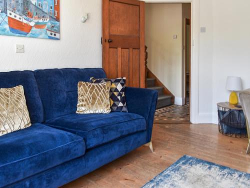 a blue couch sitting in a living room at 2 Le Dorney Villa - Uk49804 in Par