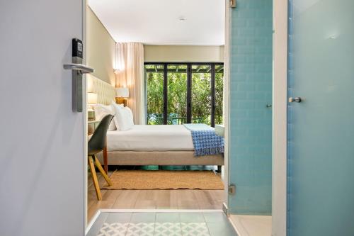 Un ou plusieurs lits dans un hébergement de l'établissement Jardim da Batalha Boutique Hotel by Shiadu