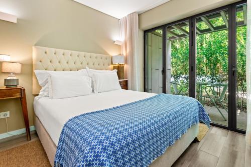 Un ou plusieurs lits dans un hébergement de l'établissement Jardim da Batalha Boutique Hotel by Shiadu
