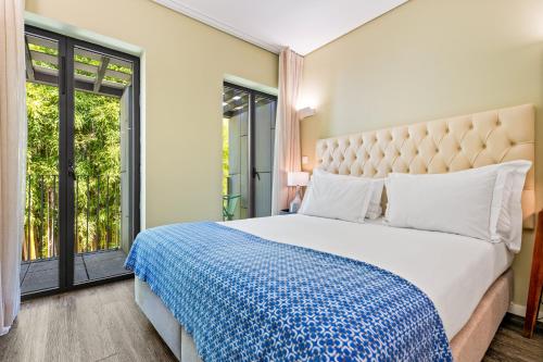Un ou plusieurs lits dans un hébergement de l'établissement Jardim da Batalha Boutique Hotel by Shiadu