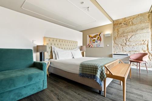 Un ou plusieurs lits dans un hébergement de l'établissement Jardim da Batalha Boutique Hotel by Shiadu
