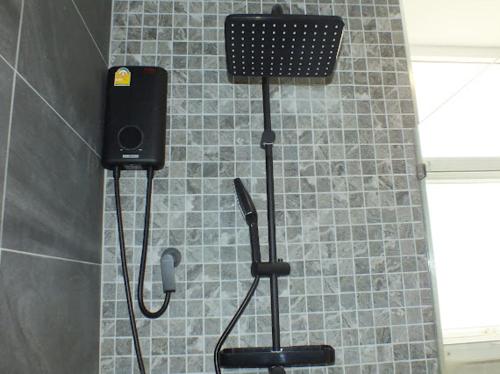 a shower with a speaker in a bathroom at Areava Pool Villa Cha-am in Cha Am