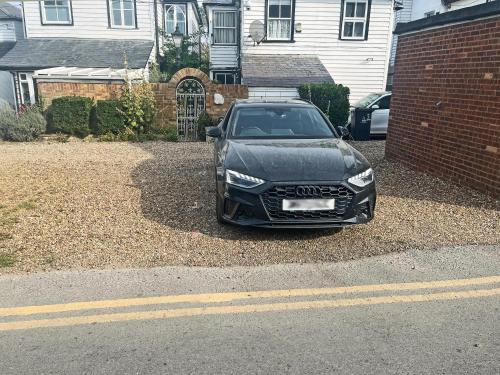 a black car parked in front of a house at Thirslet in Maldon