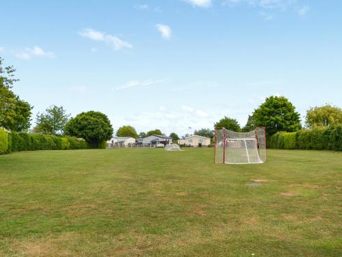 a soccer field with a goal in the grass at Sheldons Place in Patrington