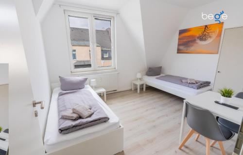 Ένα ή περισσότερα κρεβάτια σε δωμάτιο στο BEGE APARTMENTS CrewLodge