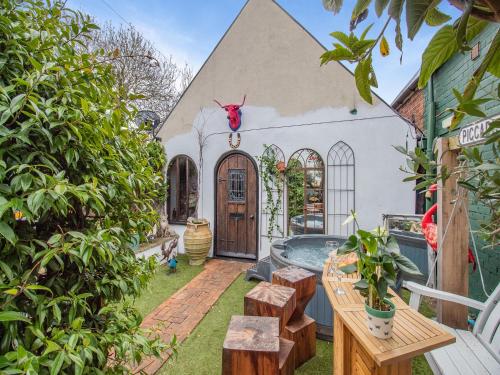 an exterior view of a house with a hot tub at Hideaway in Beccles