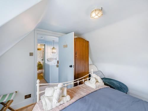 a bedroom with a bed with towels on it at Coast Away in Fraserburgh