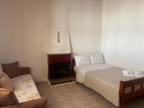 Ένα ή περισσότερα κρεβάτια σε δωμάτιο στο Georgaras Accommodation