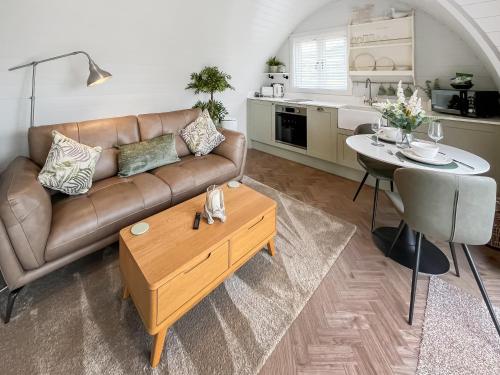 a living room with a couch and a table at Lotties Lodge - Uk49905 