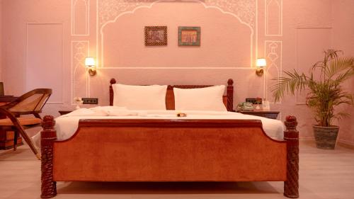 Cama o camas de una habitación en Hotel Nirali Dhani