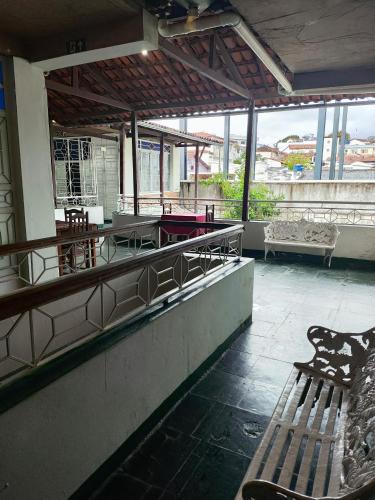 a room with a pool table and a bench at Hotel Estação in Diamantina