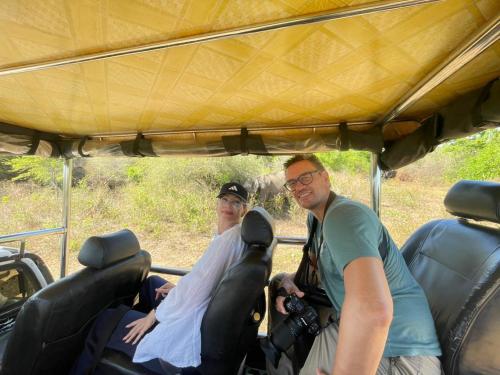 two people sitting in the back of a vehicle at Udawalawa Eco Lodge in Udawalawe
