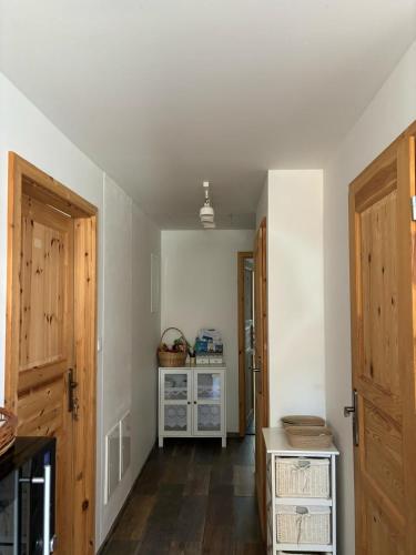 an empty room with a hallway with wooden doors at Ubytování Otín in Jindrichuv Hradec