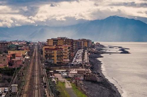 an aerial view of a city and the ocean at GIOIA Holiday Home in Torre del Greco