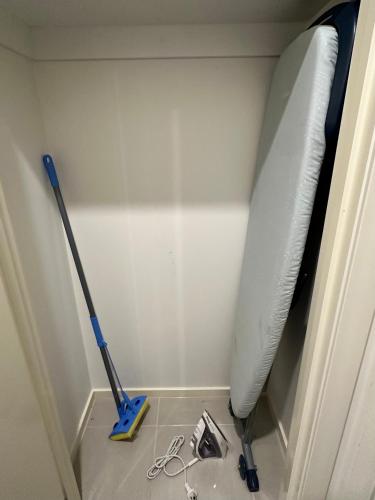 a room with a mop and a window at Stylish four bedroom family retreat in Saltwater Coast in Point Cook