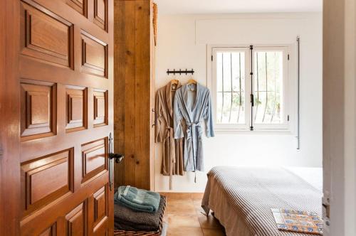 Ένα ή περισσότερα κρεβάτια σε δωμάτιο στο Finca Lliber