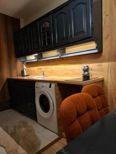 A cozinha ou cozinha compacta de H&A Apartament