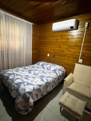 Ένα ή περισσότερα κρεβάτια σε δωμάτιο στο Casa aconchegante inteira - Casa por Dia Imbituba SC