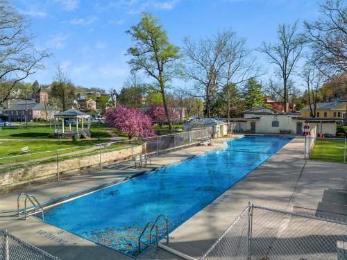 a large swimming pool with blue water at Wooded Nest, Cozy 3BR Chalet Near Spas, Downtown Berkeley Springs & Hiking in Berkeley Springs