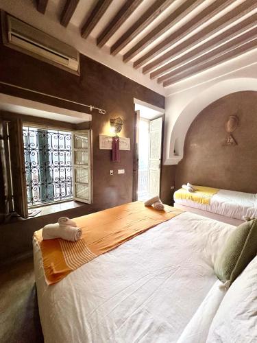 a bedroom with two large beds in a room at Riad Green Palm in Marrakech