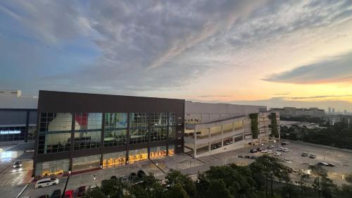 a large building with a parking lot in front of it at ValueRoomz Aeon Tebrau City IKEA G2S NOW Ready in Johor Bahru