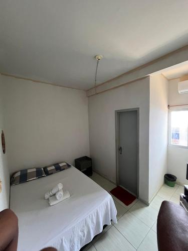 Ένα ή περισσότερα κρεβάτια σε δωμάτιο στο Pousada santos