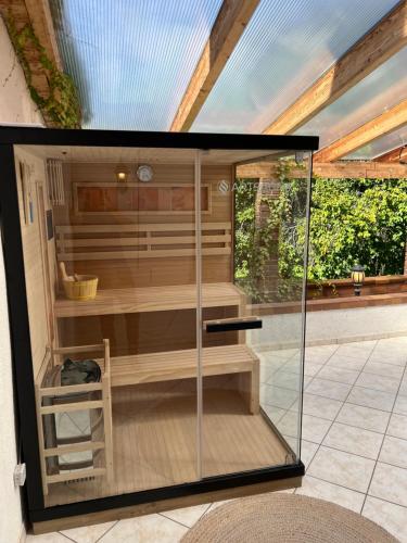 a sauna in a house with a roof at Kurpark Ferienwohnung in Schleiden