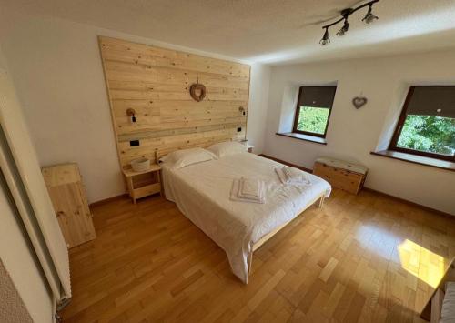 Postel nebo postele na pokoji v ubytování Rifugio di Niki e Kristine