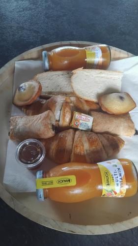a tray of hot dogs and other food on a table at Lodge climatisé avec vue panoramique in Saint-Sorlin