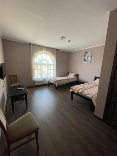 Ένα ή περισσότερα κρεβάτια σε δωμάτιο στο Готель Яр