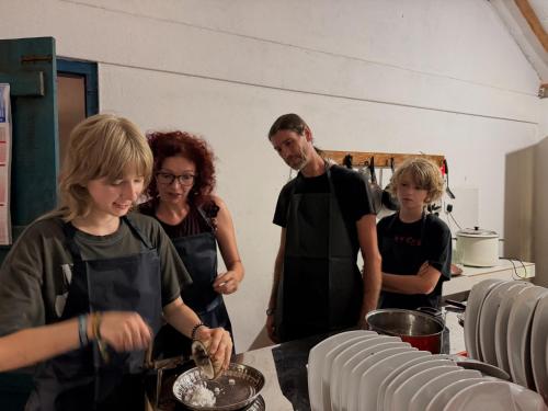 a group of people in a kitchen preparing food at Agro Village Resort , Kalpitiya in Kalpitiya