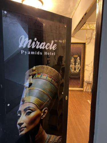 a store window with a statue of a woman at Miracle Pyramids View Hotel in Giza