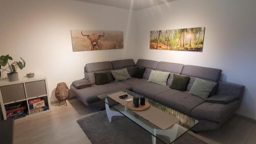 a living room with a couch and a table at Ferienwohnung Am Meisenberg in Marsberg