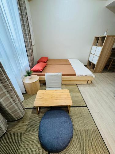 Maple Grove Yasuragi Stayにあるベッド