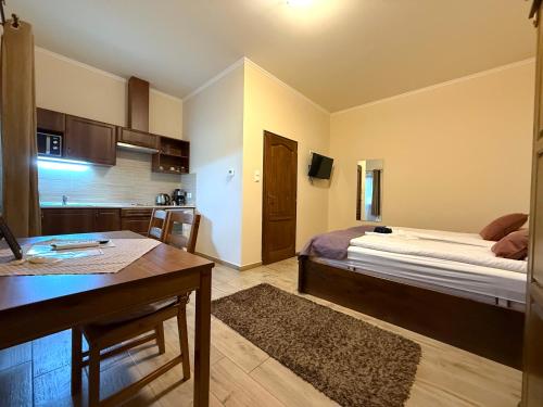 Toscana Apartmanにあるベッド