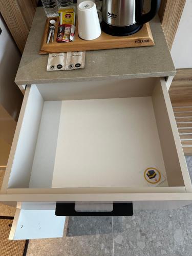 a drawer in a cupboard in a kitchen at Melekona House in Kartepe