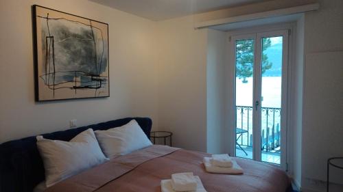 Katil atau katil-katil dalam bilik di Rivalago - Lake front apartment on Lake Promenade