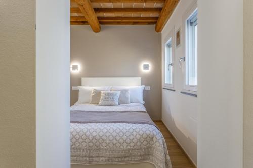 Ένα ή περισσότερα κρεβάτια σε δωμάτιο στο Corso Adriano 13 - I Portici