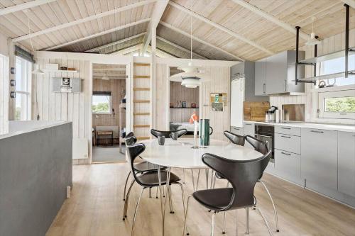 a kitchen and dining room with a table and chairs at G608-Lemvig-Gyvelvej-8 in Lemvig