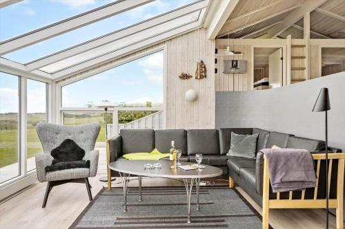 a living room with a couch and a table at G608-Lemvig-Gyvelvej-8 in Lemvig