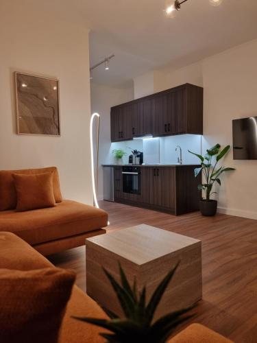 a living room with a couch and a table at KC Apartments 3 in Berat