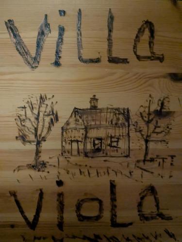 a drawing of a house on a wooden table at Villa Viola 