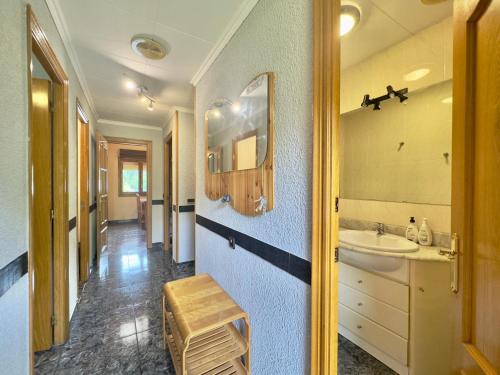 a bathroom with a sink and a mirror at Apartamento rural en Los Pirineos in Guardiola de Berguedà