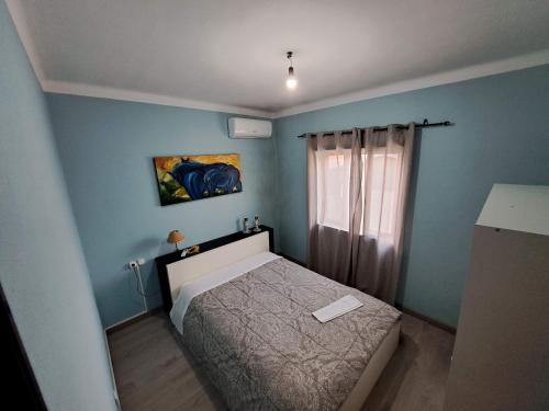 Ένα ή περισσότερα κρεβάτια σε δωμάτιο στο Casa Azélia e Albino