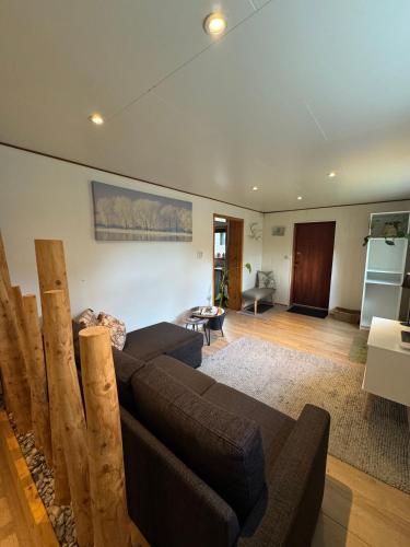 a living room with a couch and a table at The Crush in Ersfjordbotn