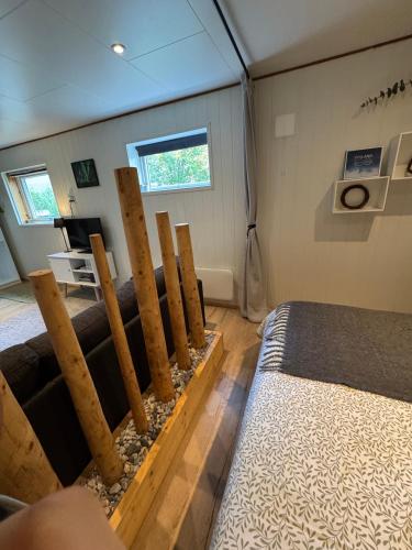 a small room with a bed and a table at The Crush in Ersfjordbotn