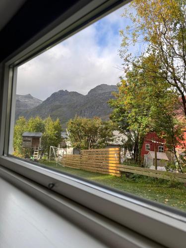 a window view of a mountain view from a house at The Crush in Ersfjordbotn