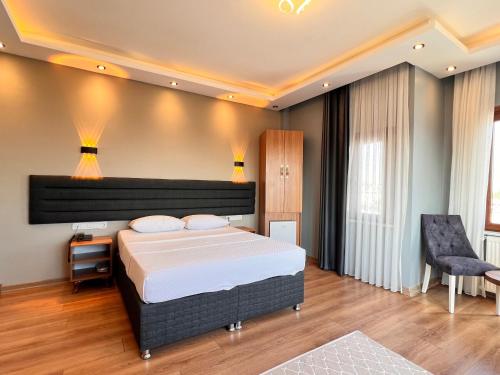 Ένα ή περισσότερα κρεβάτια σε δωμάτιο στο Mamma Marya Hotel