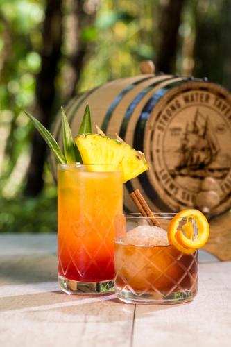 two cocktails on a table with a wooden barrel at Universal's Loews Sapphire Falls Resort in Orlando