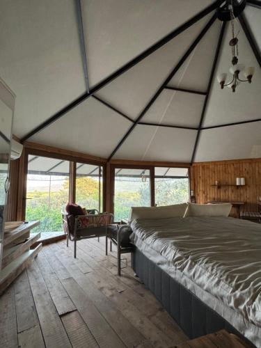 a bedroom with a large bed in a tent at İncir Bungalov Karavan Park Efes-Kuşadası in Aydın